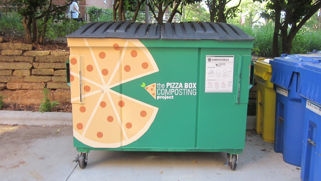 dumpster painted with giant pizzas on it to let students know to put their pizza/pizza boxes inside for composting