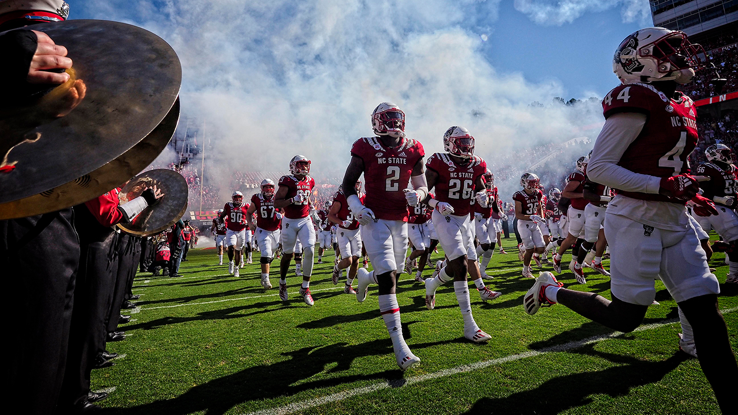 The NC State football team takes to the field against Clemson in 2021. Photo by Marc Hall