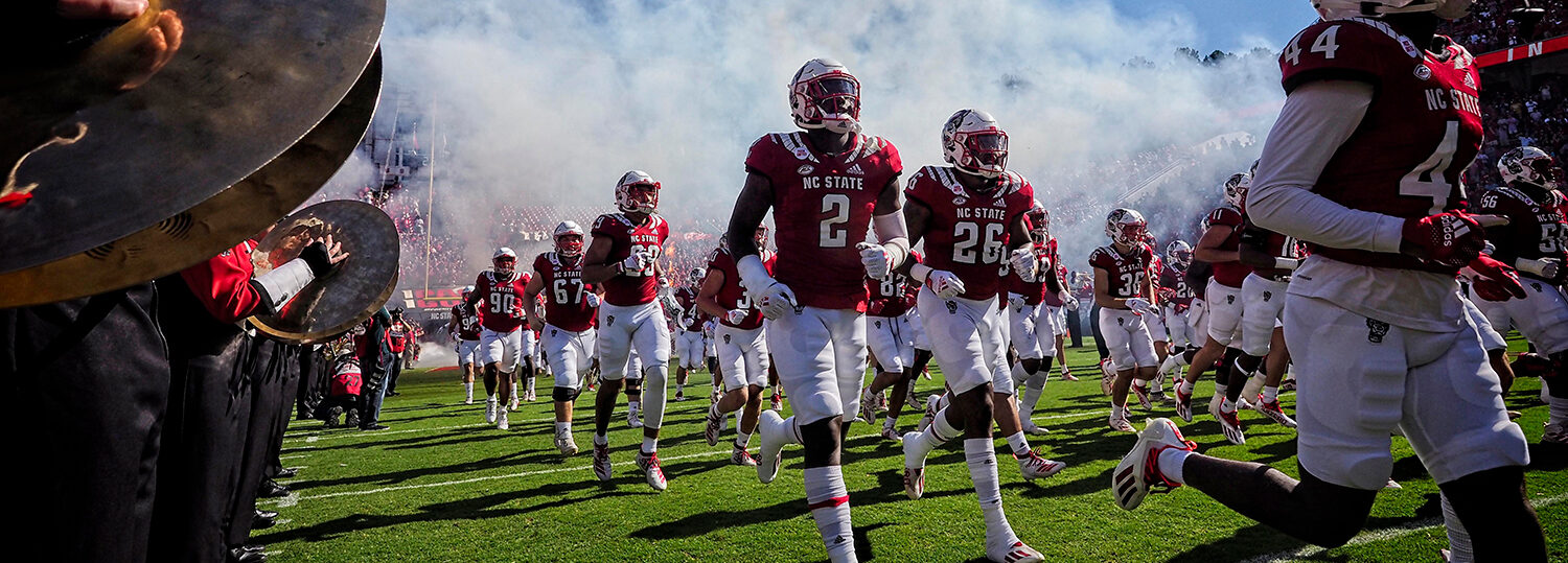 The NC State football team takes to the field against Clemson in 2021. Photo by Marc Hall